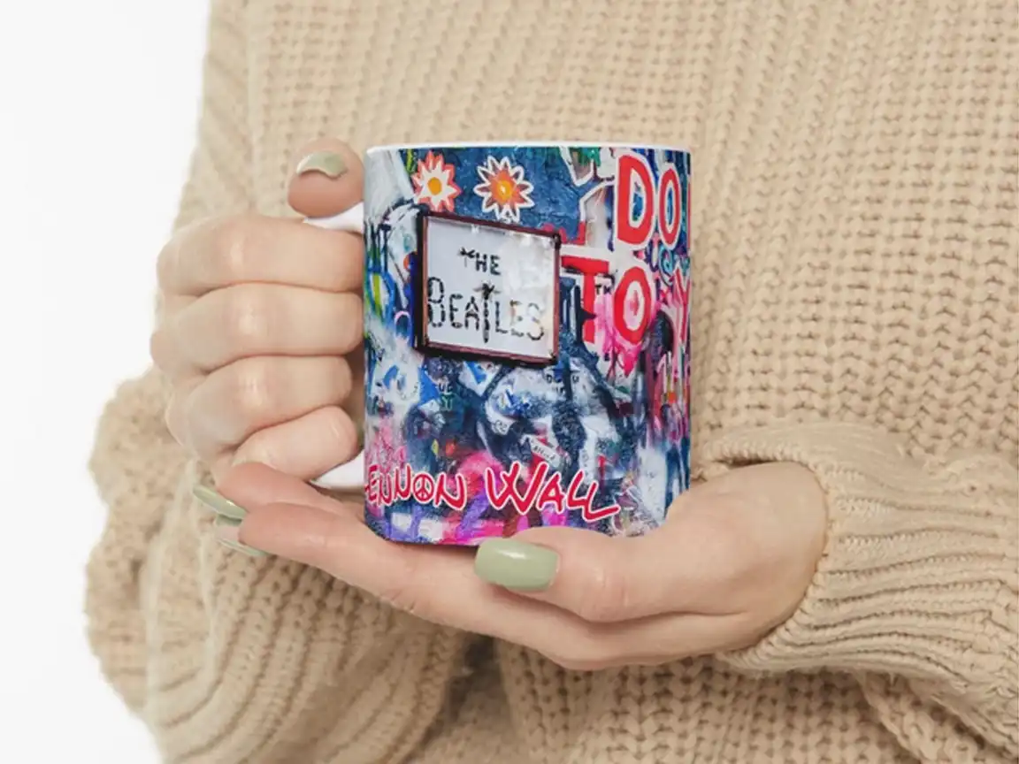 John Lennon Wall Art Mug featuring colorful graffiti from Prague's Lennon Wall, including a stencil of John Lennon and the text 'DO NOT LIE TO YOURSELF,' perfect for Beatles fans and street art enthusiasts.