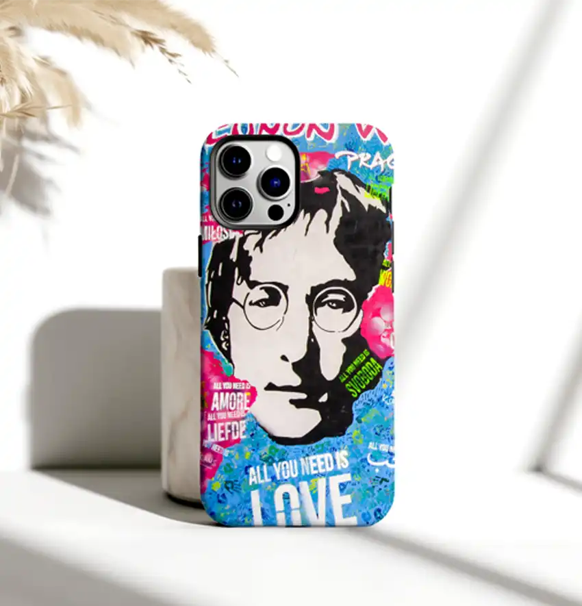 John Lennon Wall phone case featuring vibrant graffiti-inspired art, showcasing the iconic Prague landmark. Designed to fit 55 phone models, including iPhone, Galaxy, and Pixel. Durable dual-layer construction with a matte finish, wireless charging compatible, and perfect for art-loving music fans.