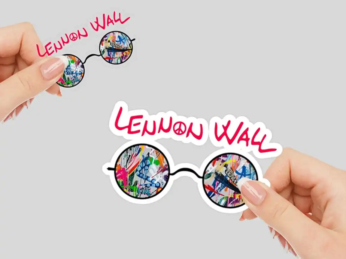 Lennon Wall vinyl sticker featuring bold 'LENNON WALL' graffiti text and John Lennon's signature glasses filled with vibrant street art from Prague, perfect for Beatles fans and street art lovers.