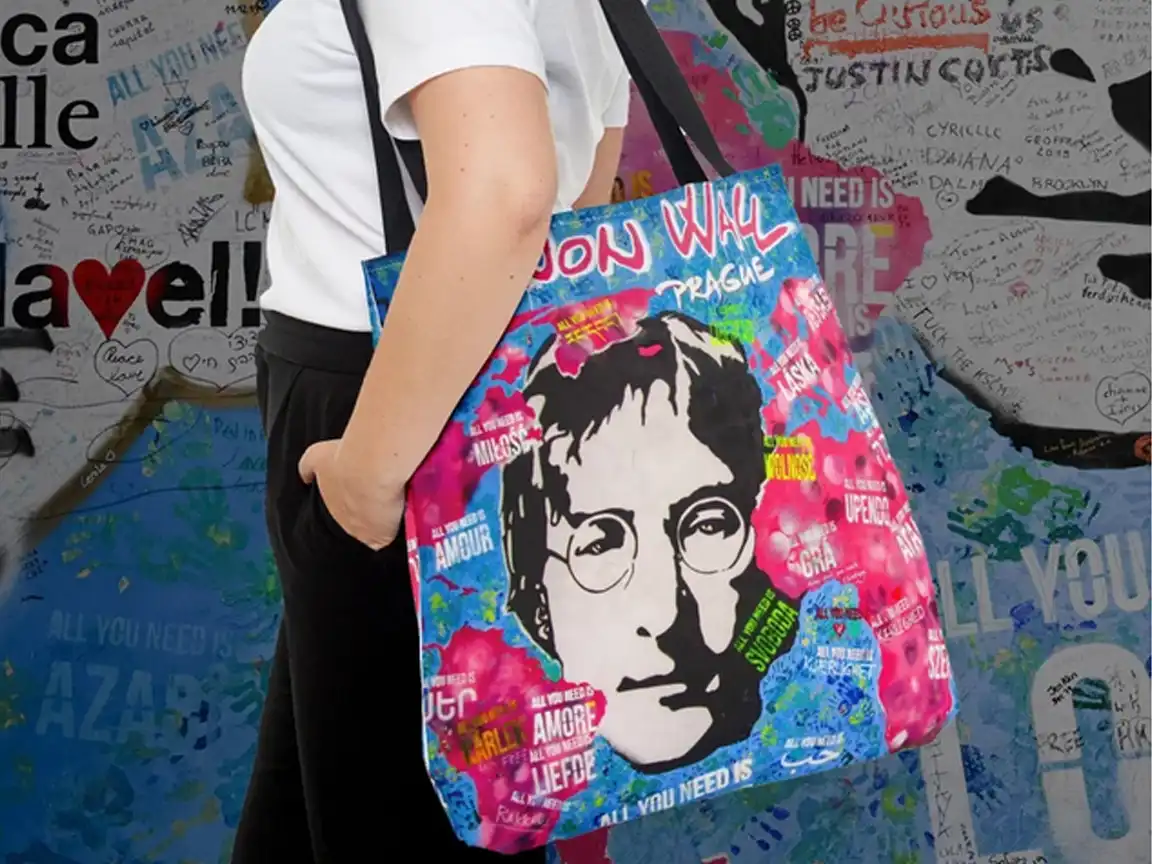 John Lennon Wall Tote Bag featuring vibrant graffiti art from Prague's iconic Lennon Wall, with a stencil of John Lennon, available in 3 sizes and 5 handle color options, perfect for Beatles fans and street art lovers.