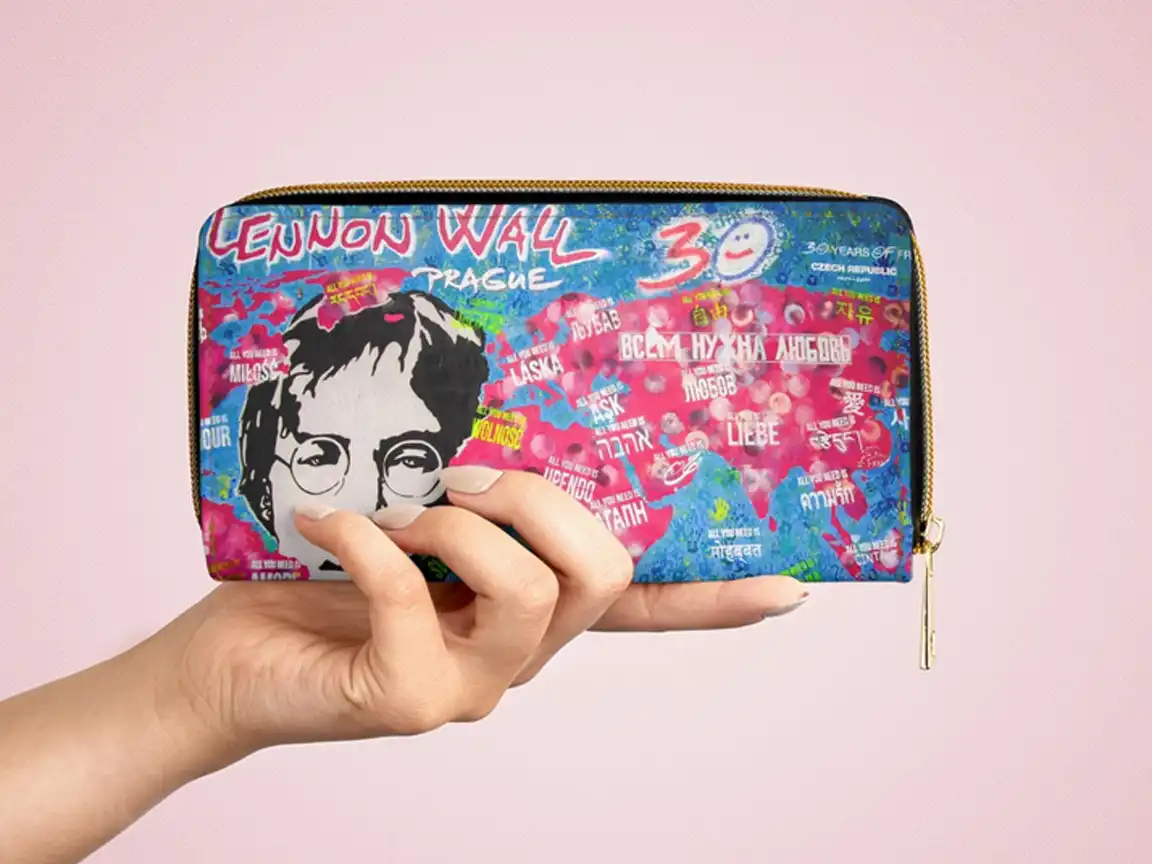 Zipper wallet featuring authentic Lennon Wall Art with a large stencil of John Lennon surrounded by colorful graffiti in Prague.