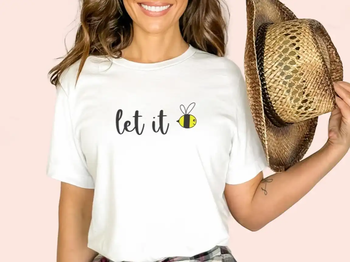 Let It Bee Beatles shirt featuring a playful twist on the classic hit with a bee design, made from 100% Airlume combed and ring-spun cotton, perfect for Beatles fans and bee lovers.
